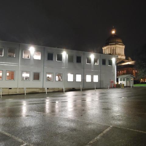 An image taken at night showing the west side of the Legislative Modular Building.