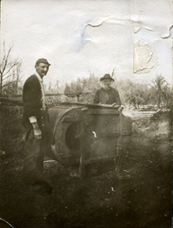 Lewis Nisqually Bush and Henry Sanford Bush pictured with a fanning mill circa 1895-1915.