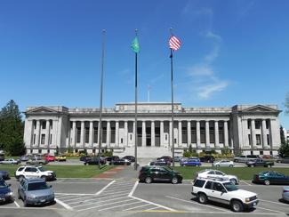 The flag circle is in between the Temple of Justice and the Legislative Building. 