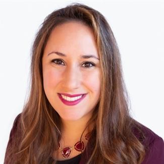 A headshot of Ashlee Delaney with a white background.