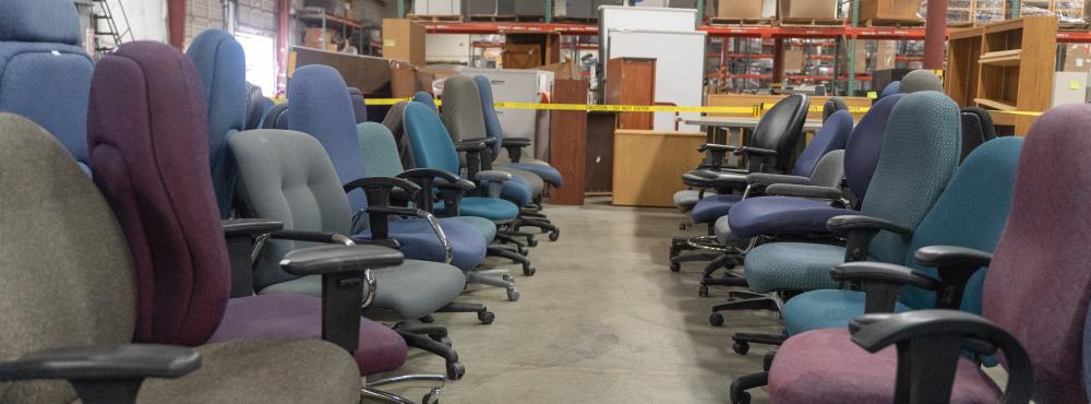 Used office chairs stored in the surplus warehouse