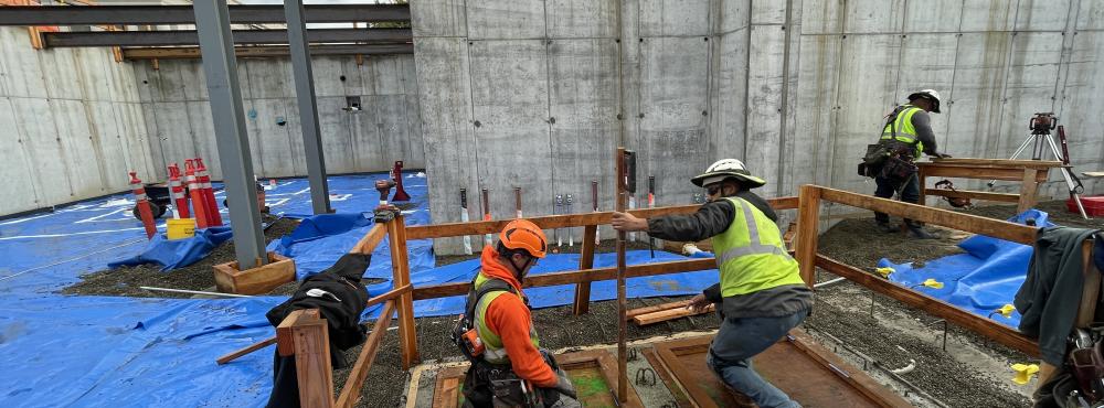 Concrete workers get rebar ready for a concrete foundation pour on a public works project