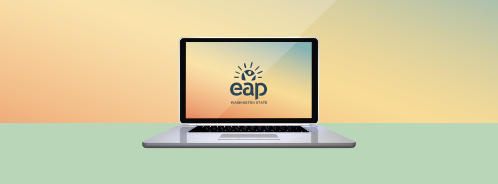 An open laptop with the Washington State Employee Assistance Program (EAP) logo on the screen.