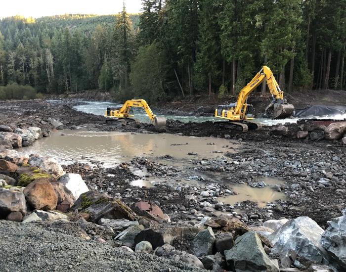 Construction equipment working in river