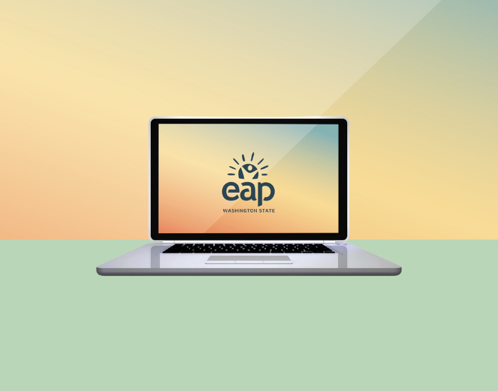An open laptop with the Washington State Employee Assistance Program (EAP) logo on the screen.