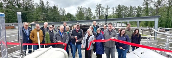 Ribbon cutting at the North Bend wastewater treatment plant drew a crowd of employees.