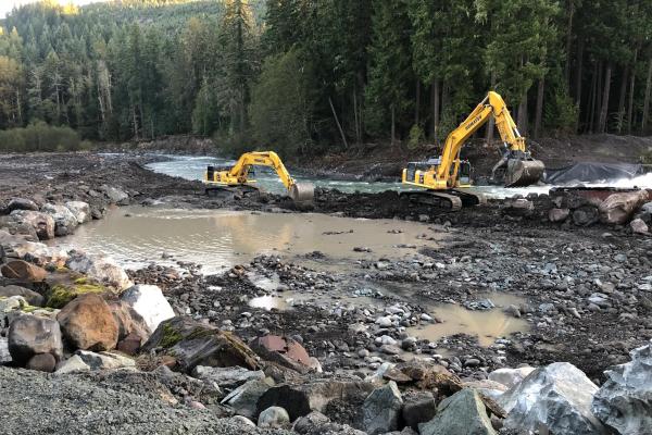 Construction equipment working in river