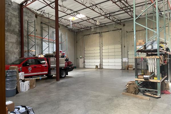 Warehouse with fire engine parked inside