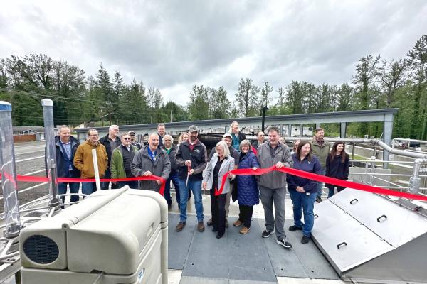 Ribbon cutting at the North Bend wastewater treatment plant drew a crowd of employees.