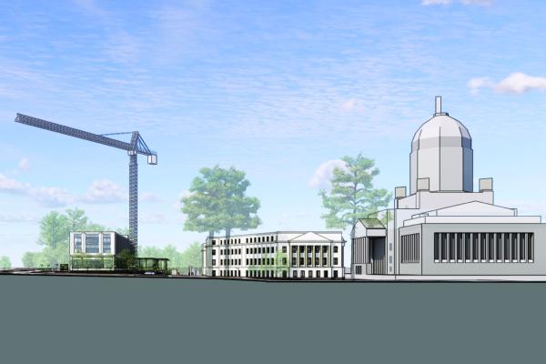 A conceptual rendering of a crane towering above the Pritchard Library construction site, with the Cherberg, Insurance, and Legislative Buildings to the south of the site.
