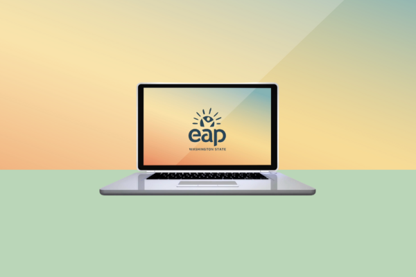 An open laptop with the Washington State Employee Assistance Program (EAP) logo on the screen.